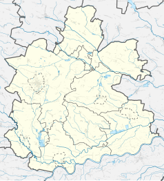 Mapa konturowa powiatu buskiego, blisko lewej krawiędzi znajduje się punkt z opisem „Skotniki Górne”