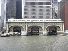 The Battery Maritime Building as seen from the East River, with buildings behind it