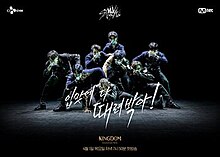 A poster with black background where a single lights focused on the eight members of Stray Kids, who pose with wolf a tattoo at the back of their hands placed in front of their own mouth, in formation of inverted human pyramid