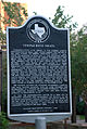 Taxas Historic Landmark marker at the former synagogue site
