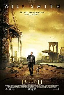 A man wearing leather clothes and holding a rifle walks alongside a dog on an empty street. A destroyed bridge is seen in the background. Atop the image is "Will Smith" and the tagline "The last man on Earth is not alone". Below is the film's title and credits.