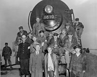 Rhee and his wife posing with Army Corps of Engineers personnel in 1950 at the Han River Bridge