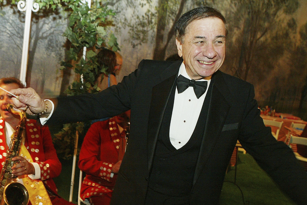 LOS ANGELES - NOVEMBER 30:  Musical composer Richard Sherman conducts the band at the after-party for Disney's "Mary Poppins" 40th Anniversary Edition DVD Launch party and screening at Hollywood and Highland on November 30, 2004 in Los Angeles, California. (Photo by Kevin Winter/Getty Images)