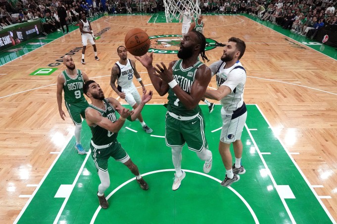 BOSTON, MASSACHUSETTS - JUNE 17: Jaylen Brown #7 grabs a rebound over Jayson Tatum #0 of the Boston Celtics against the Dallas Mavericks during the fourth quarter of Game Five of the 2024 NBA Finals at TD Garden on June 17, 2024 in Boston, Massachusetts. NOTE TO USER: User expressly acknowledges and agrees that, by downloading and or using this photograph, User is consenting to the terms and conditions of the Getty Images License Agreement. (Photo by Peter Casey - Pool/Getty Images)