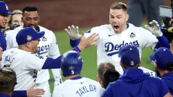 LOS ANGELES, CALIFORNIA - OCTOBER 25: Freddie Freeman #5 of the Los Angeles Dodgers celebrates with teammates after hitting a walk-off grand slam during the tenth inning against the New York Yankees during Game One of the 2024 World Series at Dodger Stadium on October 25, 2024 in Los Angeles, California. (Photo by Steph Chambers/Getty Images)