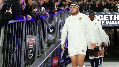 Jamie George leads out England before their match against New Zealand