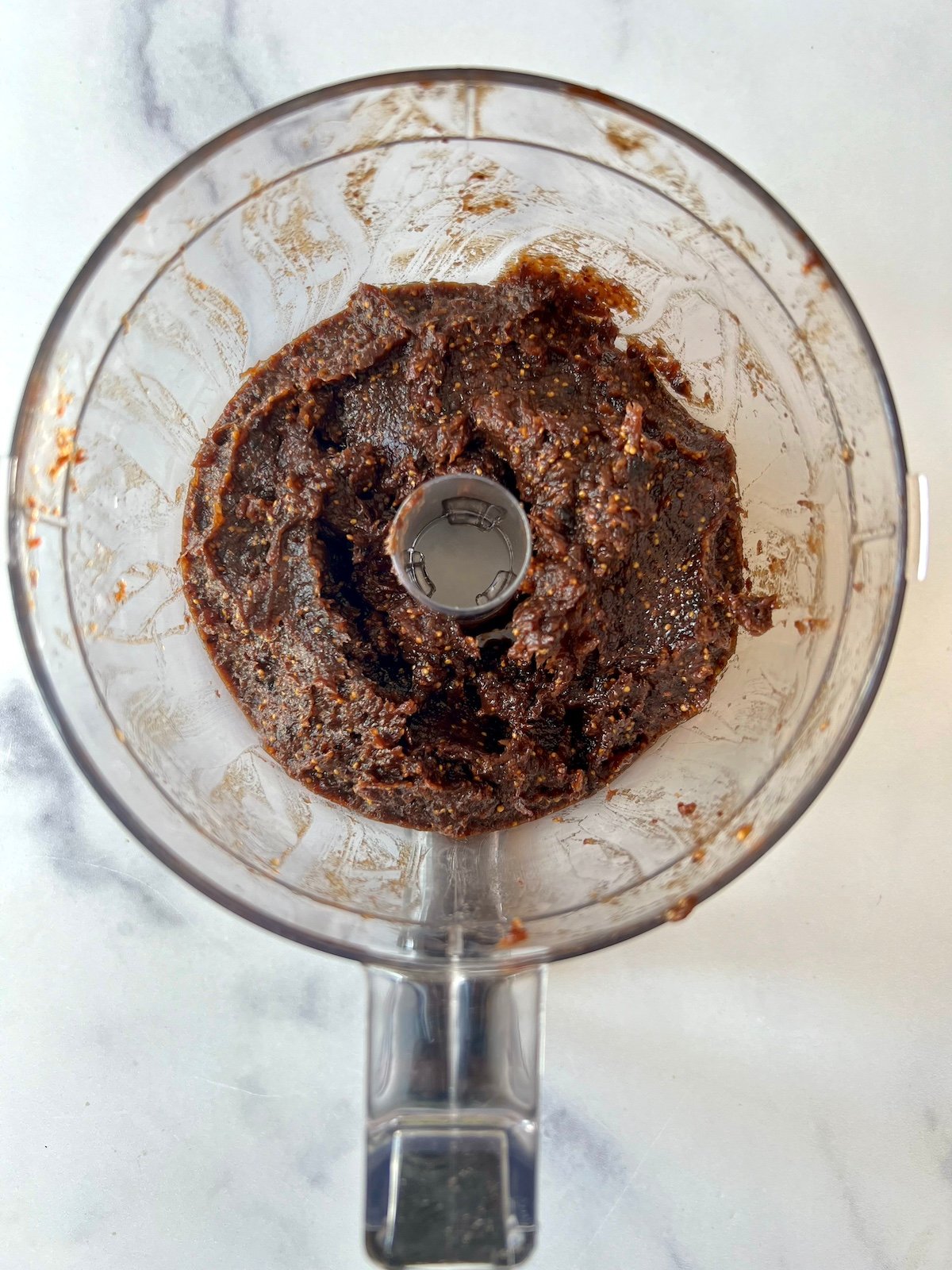 Fig mixture in food processor bowl.