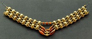 Necklace with gold beads and carnelian beads, Cypriot artwork with Mycenaean inspiration, c. 1400–1200 BC.[citation needed] From Enkomi. British Museum.