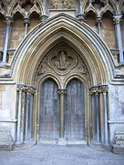 In the lowest range, many statues are lost but this group of saints remains at the back of the north tower.