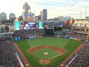 View of a baseball stadium, taken from the upper deck and looking out over the field from center. Open roof