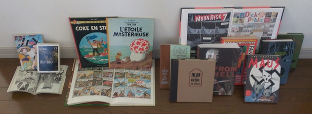  A comparison of book formats for comics around the world.  The left group is from Japan and shows the tankōbon and the smaller bunkobon formats. Those in the middle group of Franco-Belgian comics are in the standard A4-size comic album format. The right group of graphic novels is from English-speaking countries, where there is no standard format.