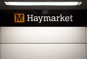 Station signage at Haymarket, branded in the new corporate colour scheme.