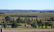 Left image shows Hinton from Brandy Hill, shortly after the June 2007 Hunter Region and Central Coast storms. The right image was taken after the floodwaters had subsided.