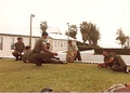 A Permanent Staff Instructor (PSI) with senior Non-Commissioned Officers of the Bermuda Regiment.