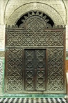 Wooden mashrabiya screen at the entrance of the courtyard