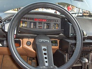 No stalks - control buttons reached by hands on steering wheel