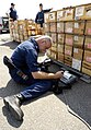 Checking bar codes on wooden ammunition boxes