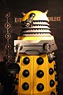 Various Dalek designs from throughout the series, including variants such as the Special Weapons Dalek and the Dalek Emperor.