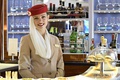 Emirates flight attendant in the A380 bar for Emirates