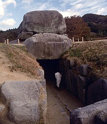 Open tomb, with a person inside for scale