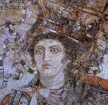 A mosaic from Thmuis (Mendes), Egypt, created by the Hellenistic artist Sophilos (signature) in about 200 BCE, now in the Greco-Roman Museum in Alexandria, Egypt; the woman depicted is probably Berenice II. Her crown showing a ship's prow and her anchor-shaped brooch symbolised the Ptolemaic Empire's naval prowess.[16]