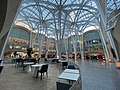 Intertwining steel arches at Sam Pollock Square