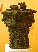 Intricate bronze ceremonial pot with glass beads, 9th century