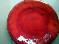 Top: a traditional Latvian plate, mottling detailBottom: a piece by Ingrīda Cepīte, shaped without using potter's wheel