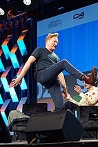 O'Brien, seen here demonstrating his long legs at SXSW in March 2024, is known for his active, spontaneous, and self-deprecating humor.