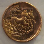 Gold coins of the Sequani Gauls, 5-1st century BC. Early Gallic coins were often inspired by Greek coinage.[2]