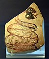 Shard of pottery decorated with a snake sticking out its tongue. Tell Arpachiyah, Iraq. Halaf period (6000-5000 BC). British Museum.