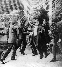 Illustration of Leon Czolgosz shooting William McKinley, with a gun concealed beneath a handkerchief