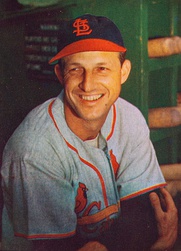 Stan Musial wearing the Cardinals' 1950s road uniform with the original navy cap and red bill.