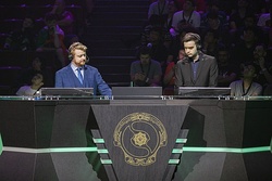 As with traditional sporting events, larger esport events, such as The International, usually feature live pre- and post-game discussion by a panel of analysts (top), with in-match casting being done by play-by-play and color commentators (bottom).