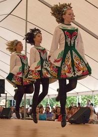 Folk dance – a trio of Irish Stepdancers performing in competition