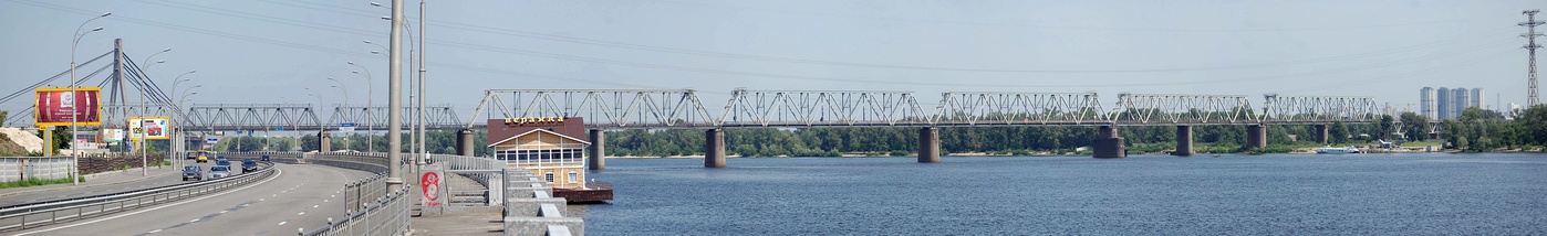  Petrivka railway bridge and the pylon of Pivnichnyi Bridge (formerly Moskovsky Bridge; view from Rybalskyi Peninsula)