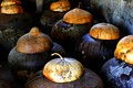 Traditional burnay jars containing fermenting bagoong in Ilocos Norte