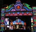 From top left to bottom right (a) A craftsperson sculpting the face of the sculpture-idol; (b) Durga Puja pandal decorations in Kolkata; (c) Interior decorations of a pandal; (d) Street lights installed during the festivities.