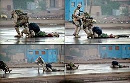 A four-picture series of photographs. Clockwise from the upper left: A Marine tries dragging a wounded Marine down a city street; a sailor runs over to help him; the rescuing Marine is shot; both Marines lie wounded on the street.