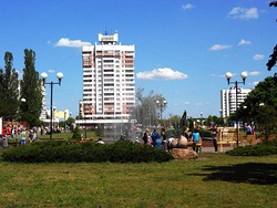 In the centre of town, with 16-floor one (left) and house with a clock (right) in sight.