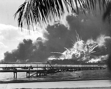 The USS Shaw explodes during the Japanese attack on Pearl Harbor.