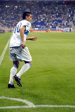 Two moments of Riquelme during his second tenure on Boca Juniors, (left): in the 2009 Audi Cup; (right): in a friendly v RCD Espanyol in 2011