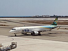 Arkia Embraer airplane with new livery at Larnaca Airport