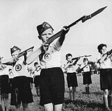 Boy members of Hlinka Youth during training with weapon, 1940