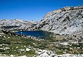 Southwest aspect of Fletcher Peak (right) above Vogelsang Lake