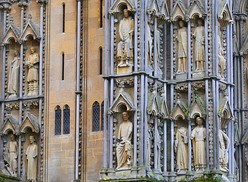 In the lowest range, many statues are lost but this group of saints remains at the back of the north tower.