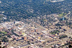 Nassau County on Long Island, New York (above) is emblematic of the continuous sprawl making up the inner suburbs of New York City, in contrast with Monroe Township, Middlesex County, New Jersey (below), characteristic of an outer suburb, or exurb, of New York City, with a lower population density.