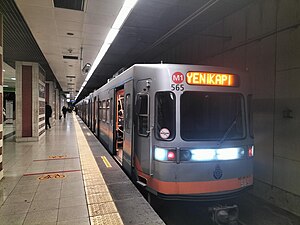 A train heading from Üçyüz Metro Station towards Yenikapı Direction