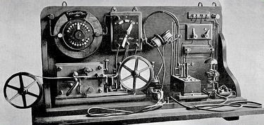 One of Marconi's first coherer receivers, used in his "black box" demonstration at Toynbee Hall, London, 1896. The coherer is at right, with the "tapper" just behind it, The relay is at left, batteries are in background