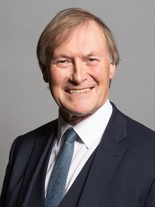 Portrait photograph of Sir David Amess smiling